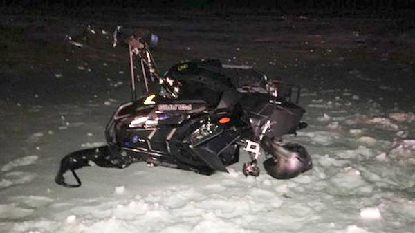 Jeff Smith snowmobile after crashing into Black Hawk helicopter